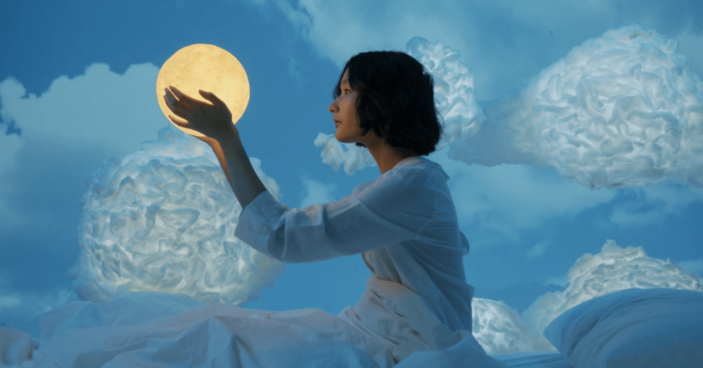 girl holding the moon