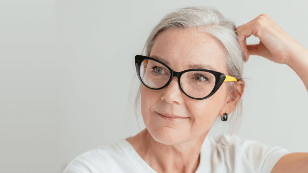 Beautiful woman white white hair and glasses