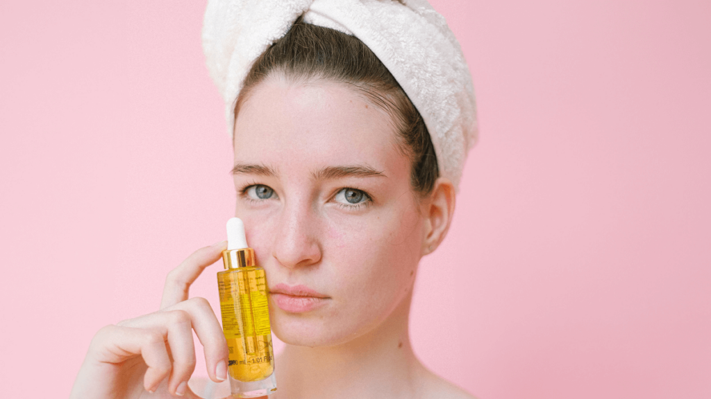 Woman holding facial oil
